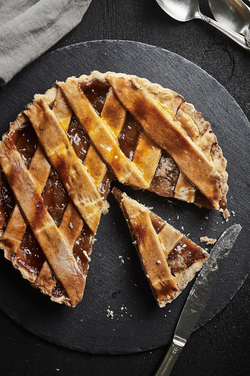 A lattice-top pie boxed up for pickup