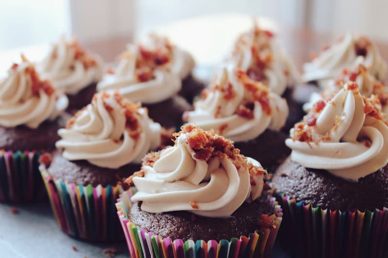 Cupcakes in paper cases on a kitchen counter