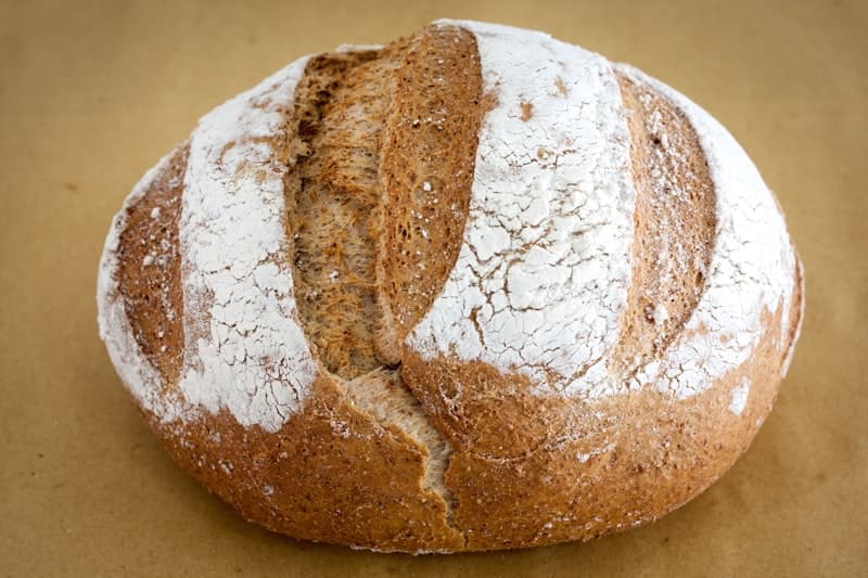 A seeded loaf on baking paper